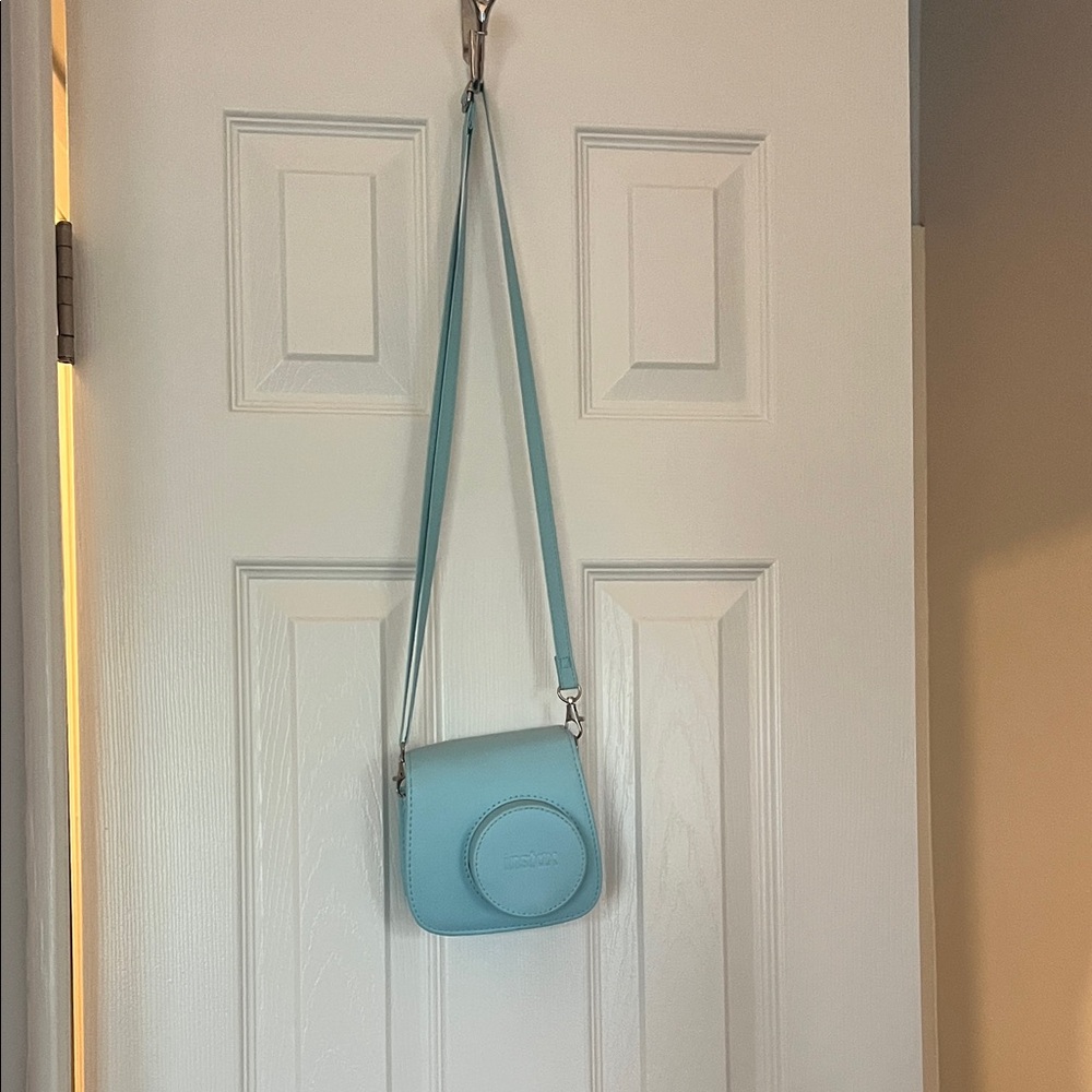 INSTAX Polaroid camera and blue case (film not included)